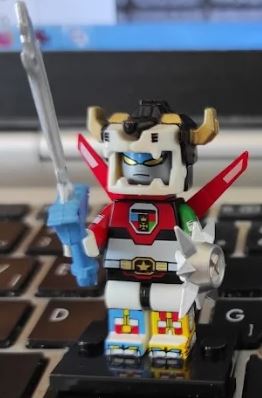 Custom LEGO Voltron minifigure showcasing the iconic lion-inspired armor, vibrant colors, and unique weaponry, embodying the spirit of teamwork and heroism from the legendary animated series, with dynamic poses reflecting its anime roots.